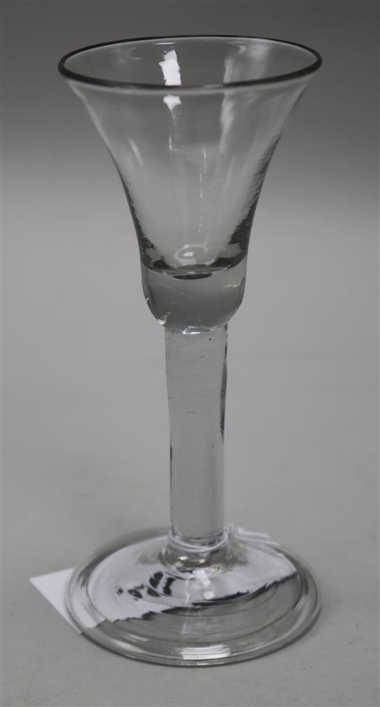 A wine glass, c.1740, with a bell bowl, on plain stem, on a folded foot, 6in.